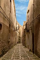 Narrow cobbled street in Erice, a medieval town, Sicily, Italy