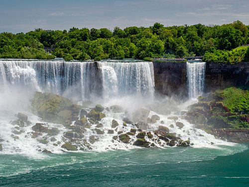 The American Falls and Bridal Veil Falls in the Niagara Falls at eye level of the Niagara River.