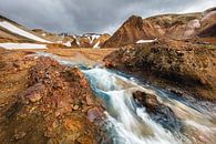 Flowing stream surrounded by mountains by Martijn Smeets thumbnail