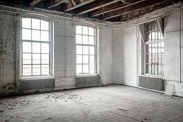 Abondoned school building interior with damaged floors and ceili