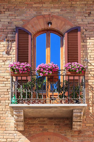 Balcony with flowers in San Gimignano, Italy by Henk Meijer Photography