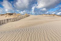Dune landscape and blue sky with clouds