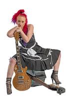 Rock'n'Roll singer with red hair sitting on a double bass