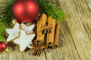 Christmas star cookies and spices on wooden table by Alex Winter