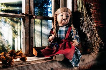 antique porcelain doll on rustic window sill by Jürgen Wiesler