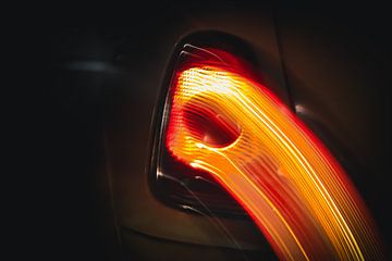 Rear light of a Mini Cooper S in motion