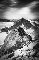 Majestic Mountain Peaks Under Moody Skies