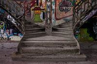 Abandoned factory with graffiti and monumental staircase
