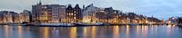 Panorama van Amsterdam aan de Amstel bij zonsondergang van Eye on You thumbnail