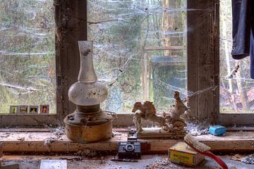 Still life in HDR of an oil lamp in front of a window urbex lost in the woods by W J Kok