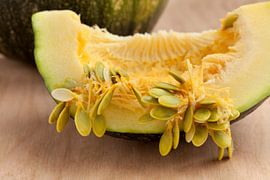 Freshly cut juicy piece of a Lady Godiva pumpkin by Frans Rombout