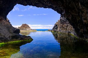 Natural pool with an arch on the coast of Madeira island