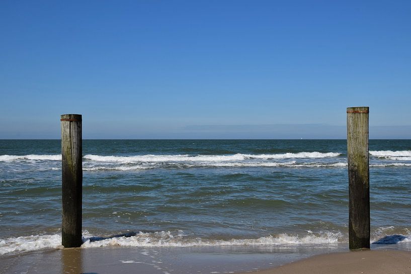 Piles in the sea at Petten beach by Corine Dekker