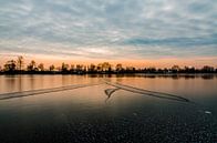 Schotterende zon ondergang boven natuurijs in Reeuwijk par Jorg van Krimpen Aperçu