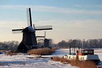 Hollandse oude windmolens in wintertafreel 