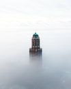 Peperbus Zwolle in de mist van Thomas Bartelds thumbnail
