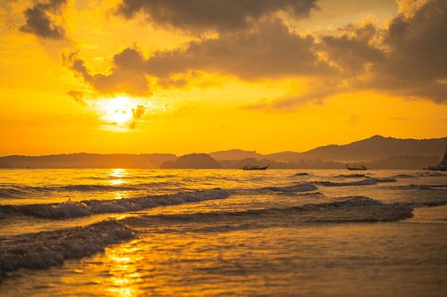 Beautiful sunset on the Aon Nang beach in Thailand.
