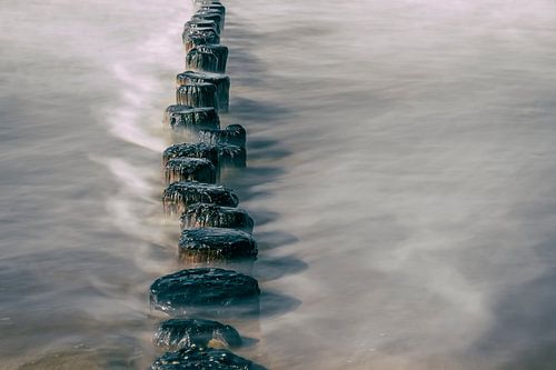 Beach poles in the surf at Cadzand-Bad.