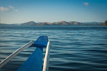 Coron Island visible from little boat dancing on the waves by Laurens Coolsen