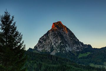 The Schwyz mountains Grosser and kleiner Mythen in Central Switzerland shine with alpenglow