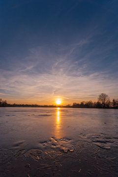 Frozen lake at sunset