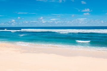 Beautiful White Beach with Bright Blue Water (Pantai Nunggalan Beach) in Bali, Indonesia by Troy Wegman