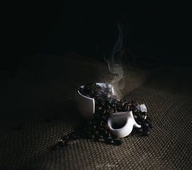Broken Ceramic Cup with Steaming Roasted Coffee Beans on Burlap Surface by SyD Fotografia