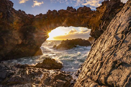 Beautiful light during sunrise behind the Natural bridge at Seroe Colorado Aruba