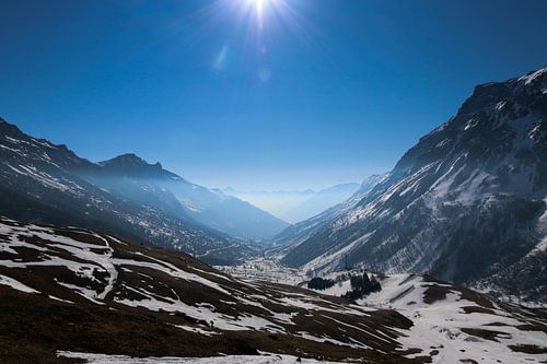 mist and sun between two mountains