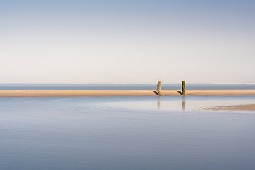 Two breakwaters at low tide in Zeeland by Claire van Dun