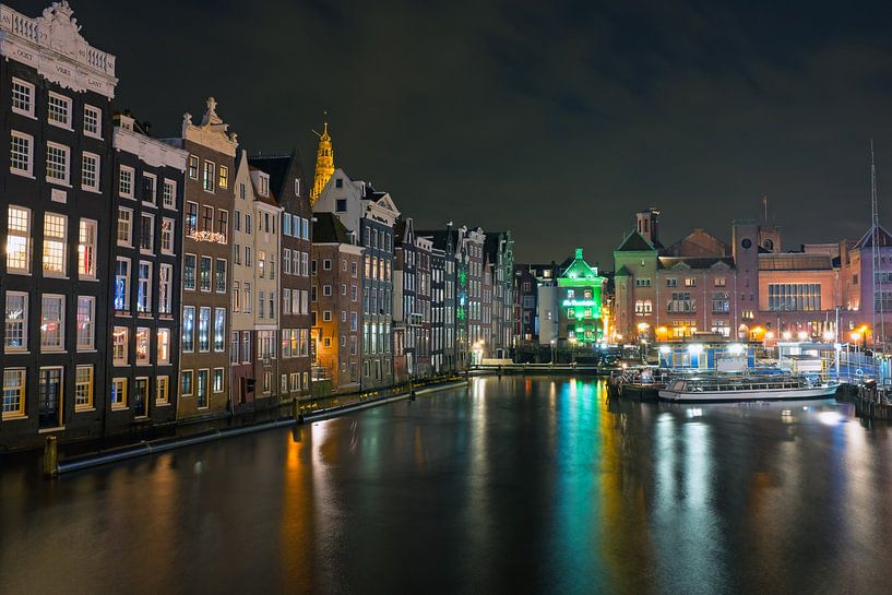 Amsterdam by night on the Damrak in the Netherlands by Eye on You