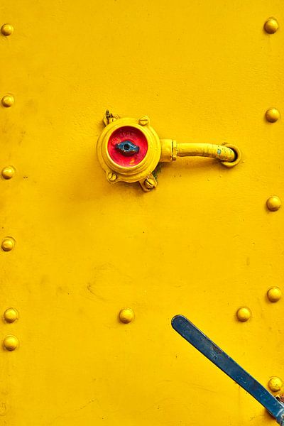 Switch in red on a yellow train by Jenco van Zalk