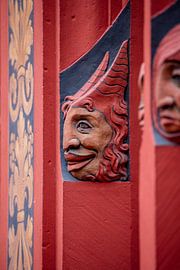 Heads next to windows of Basel Town Hall in Switzerland