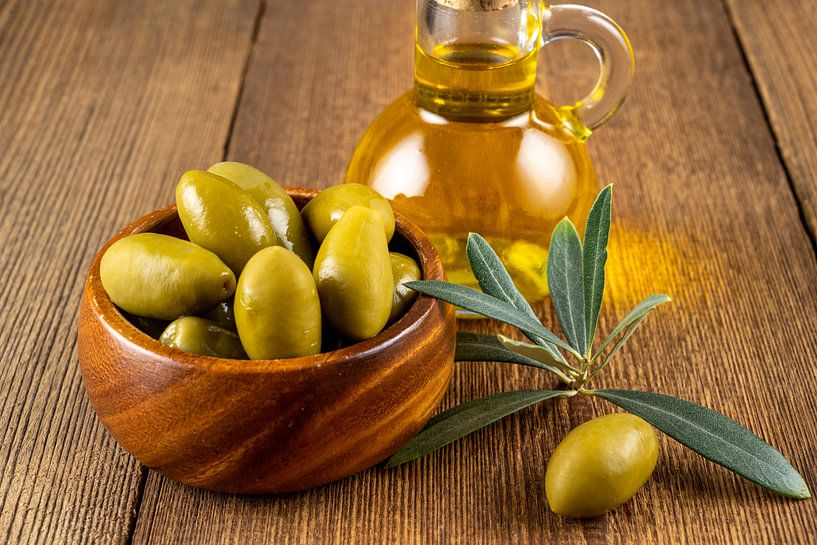 Green olives with olive branch and olive oil by Photo Art Thomas Klee