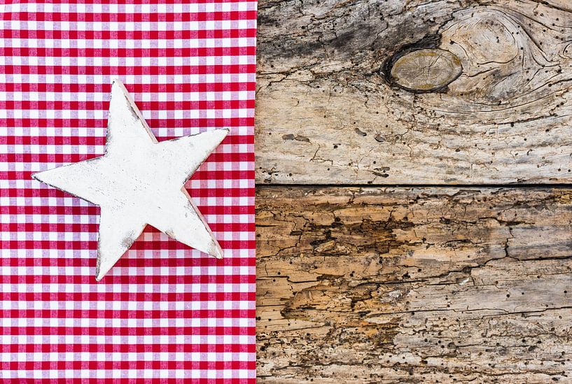 White Christmas star ornament on rustic background by Alex Winter