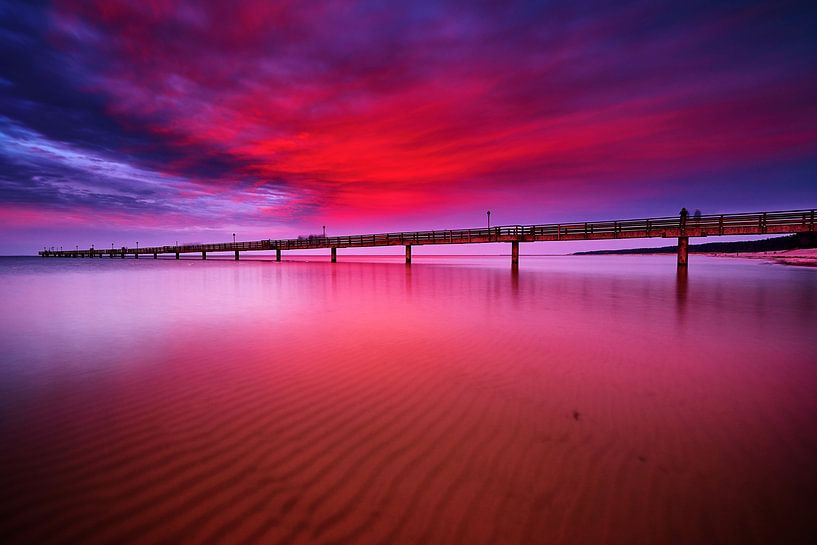Damatic afterglow after sunset on the Baltic Sea above the pier in Lubmin by Stefan Dinse