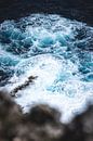 Swirling water at the bottom of the cliff of Broken Beach in Nusa Penida Bali by Ken Tempelers thumbnail