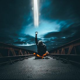 Man shoots beam of light by Martijn Van Weeghel