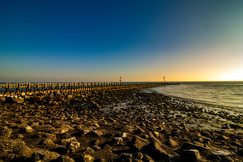 De pier van Vlissingen tijdens de zonsondergang