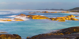 A serene coastal landscape with golden rocks in Western Australia by Chris Stenger