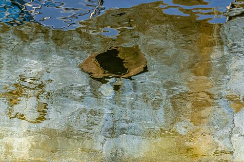 Abstract reflection in the water. by Leo Luijten