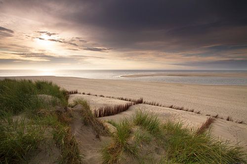Sunset on a cloudy day at the Dutch coast