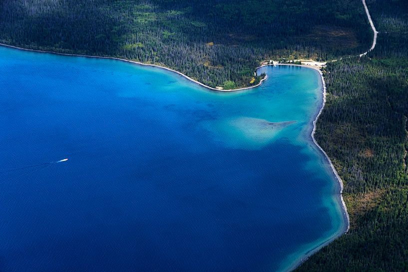 Lonely boat on a lake by Nathan Marcusse