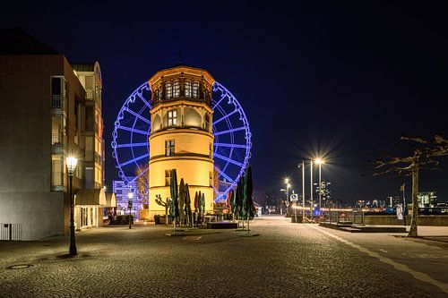 Castle tower and blue ferris wheel in Dusseldorf
