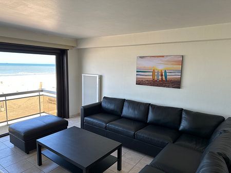Surfboarding in the beach sand at sunset
