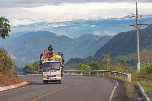 Car transporting people through the mountains