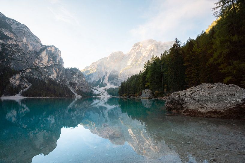 Reflections of mountain peaks in the beautiful blue-green mountain lake Lago di Braies by Marit Hilarius