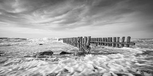 Groynes in a stormy sea at the coast of Holland