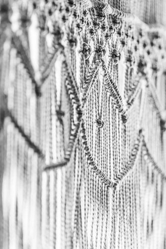 Texture d'un macramé détaillé en noir et blanc