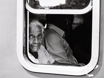 The beautiful Sri Lankan woman in a blue train by Rebecca Gruppen